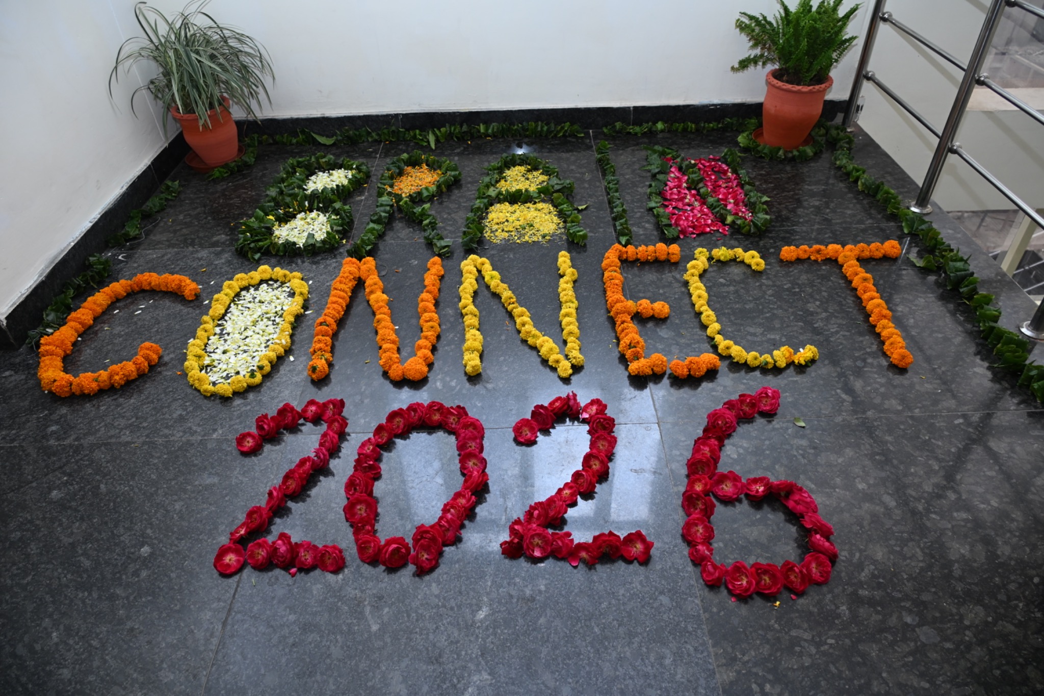 Brain Connect 2026 floral rangoli at the venue entrance